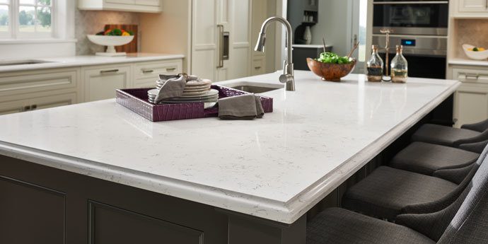 white countertop island with chairs